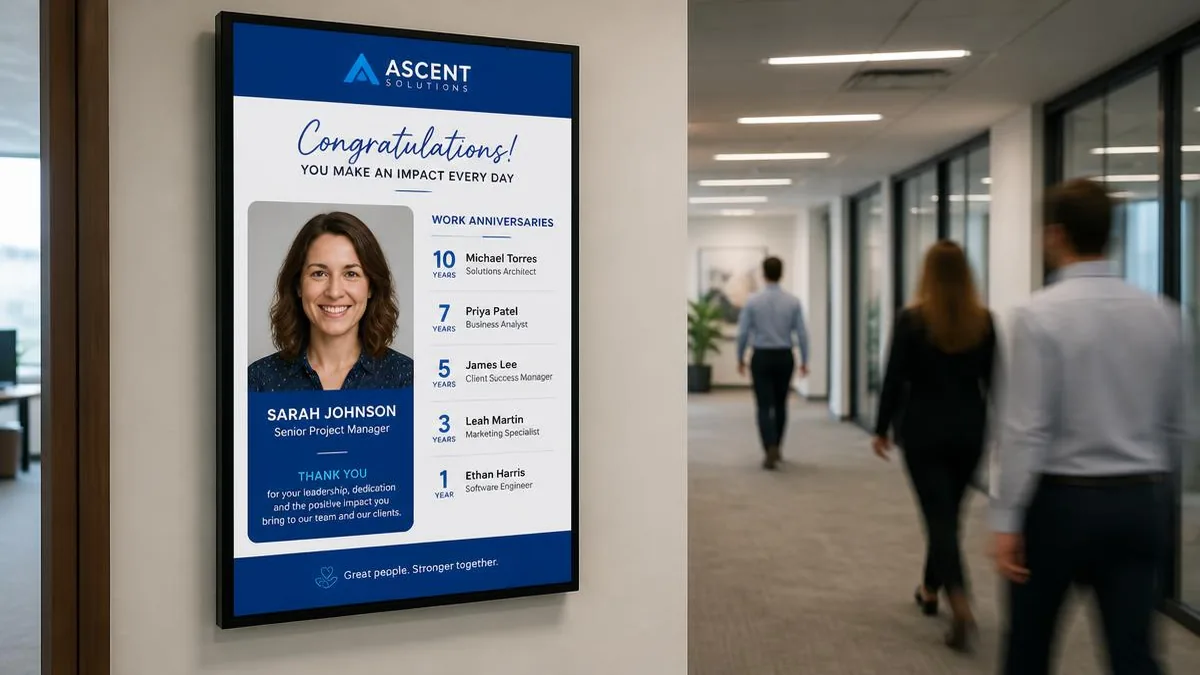 Portrait office hallway screen showing employee recognition content with a headshot and a list of work anniversaries
